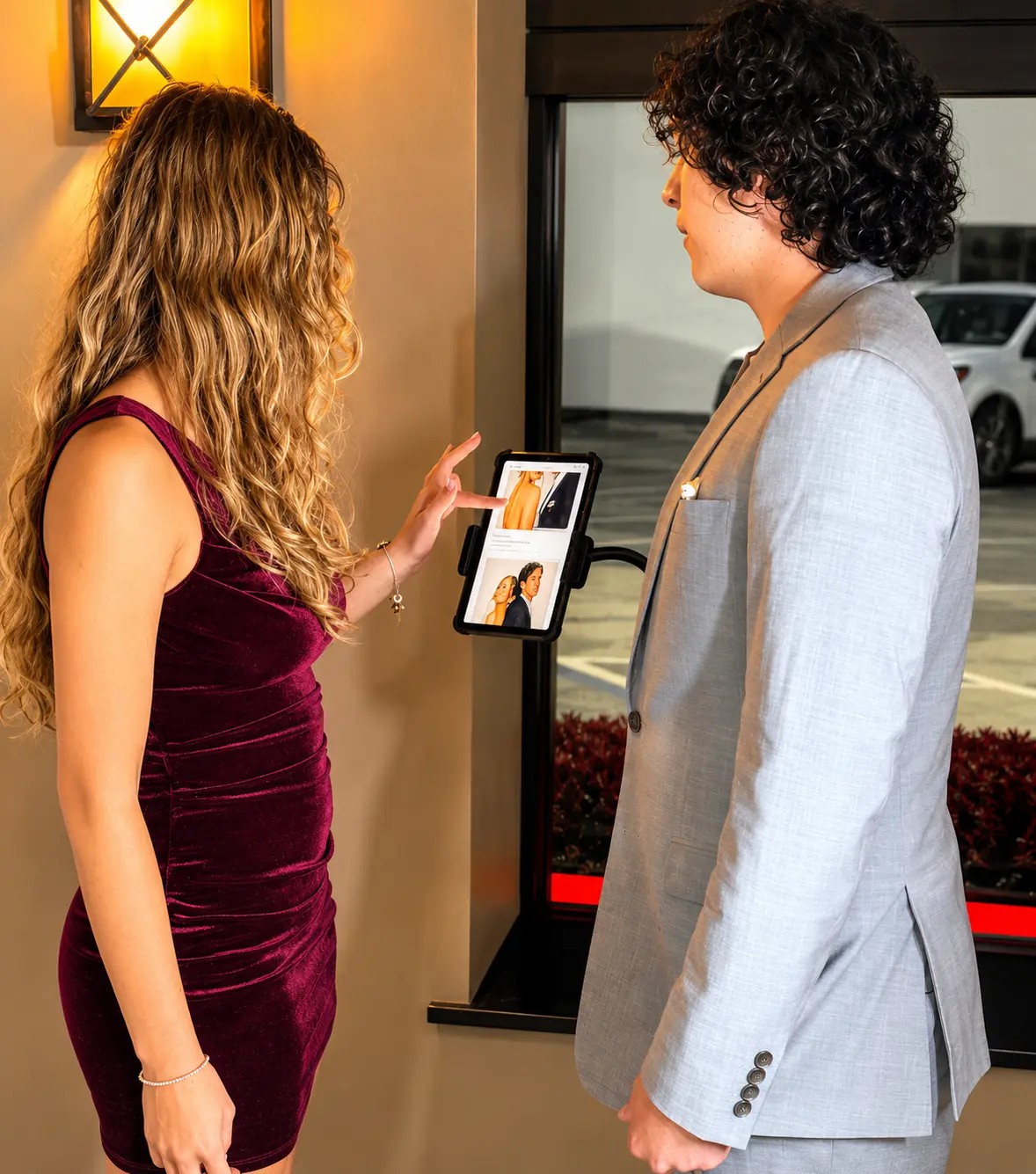 Two guests browsing pose options on the Snap-Pose Selector screen