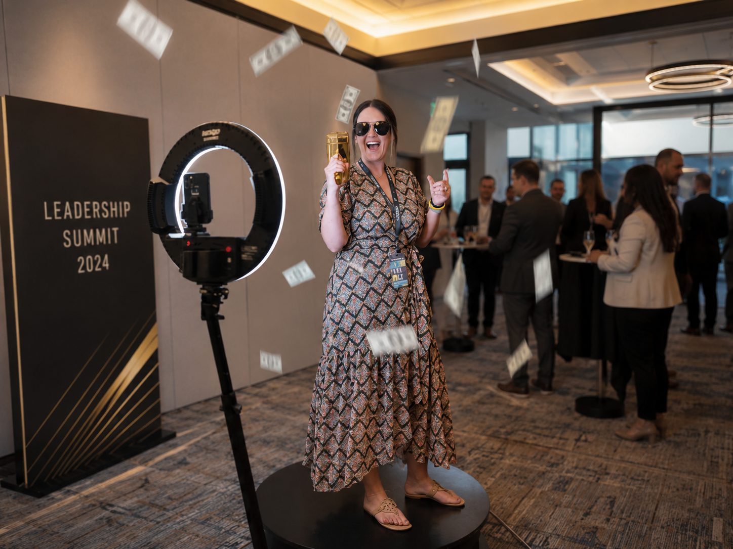 Guest celebrating on a 360 video booth platform at a Leadership Summit corporate event