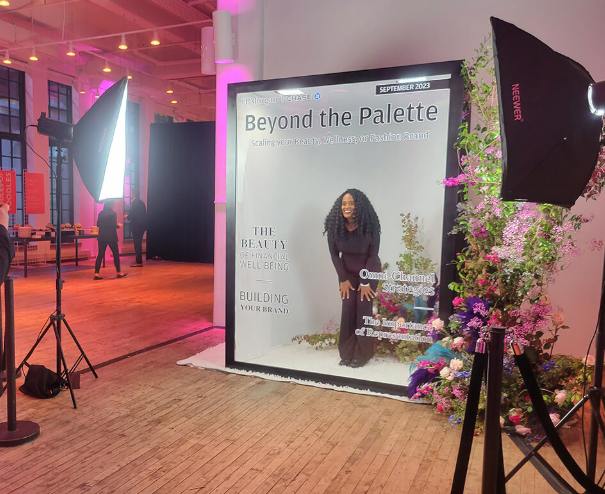Branded SnapJoy Magazine Cover Studio set with florals and studio lighting at a brand event