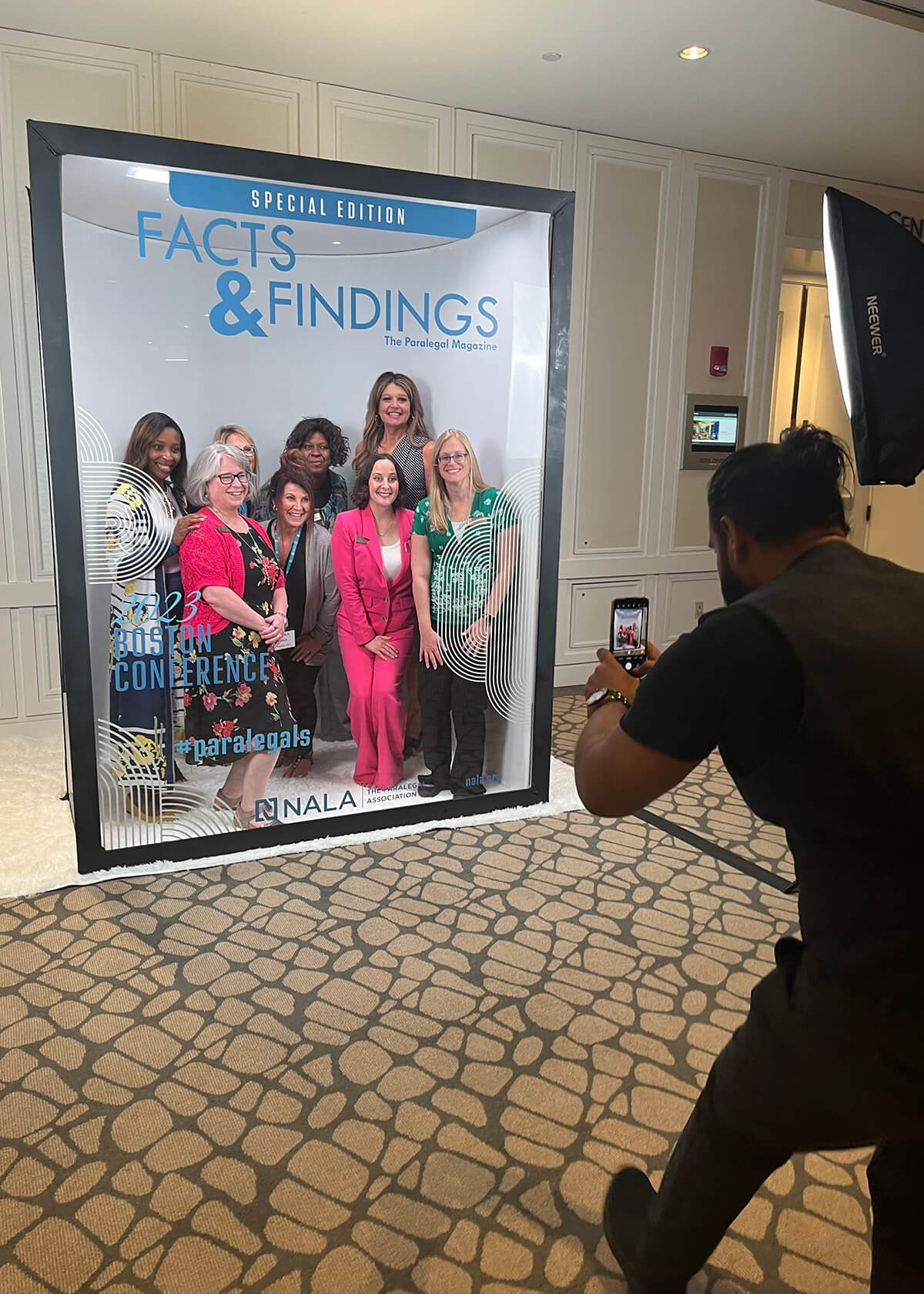 Conference attendees photographed for a special edition association magazine cover