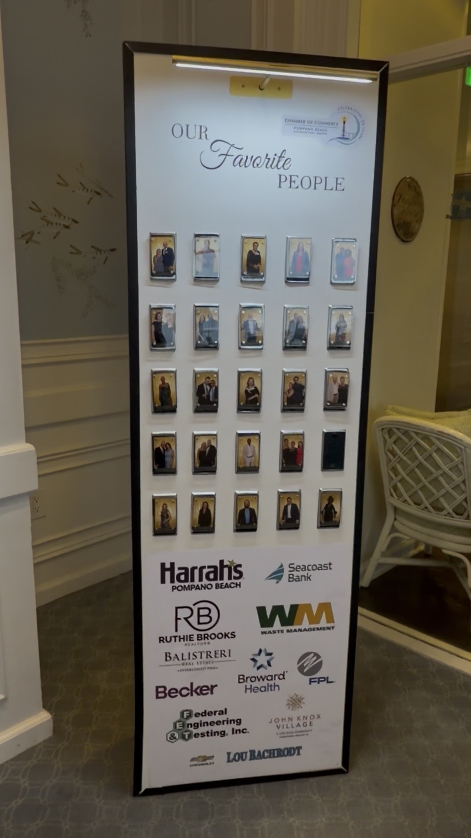 Our Favorite People magnetic photo gallery display filling with guest portraits at a Pompano Beach corporate gala
