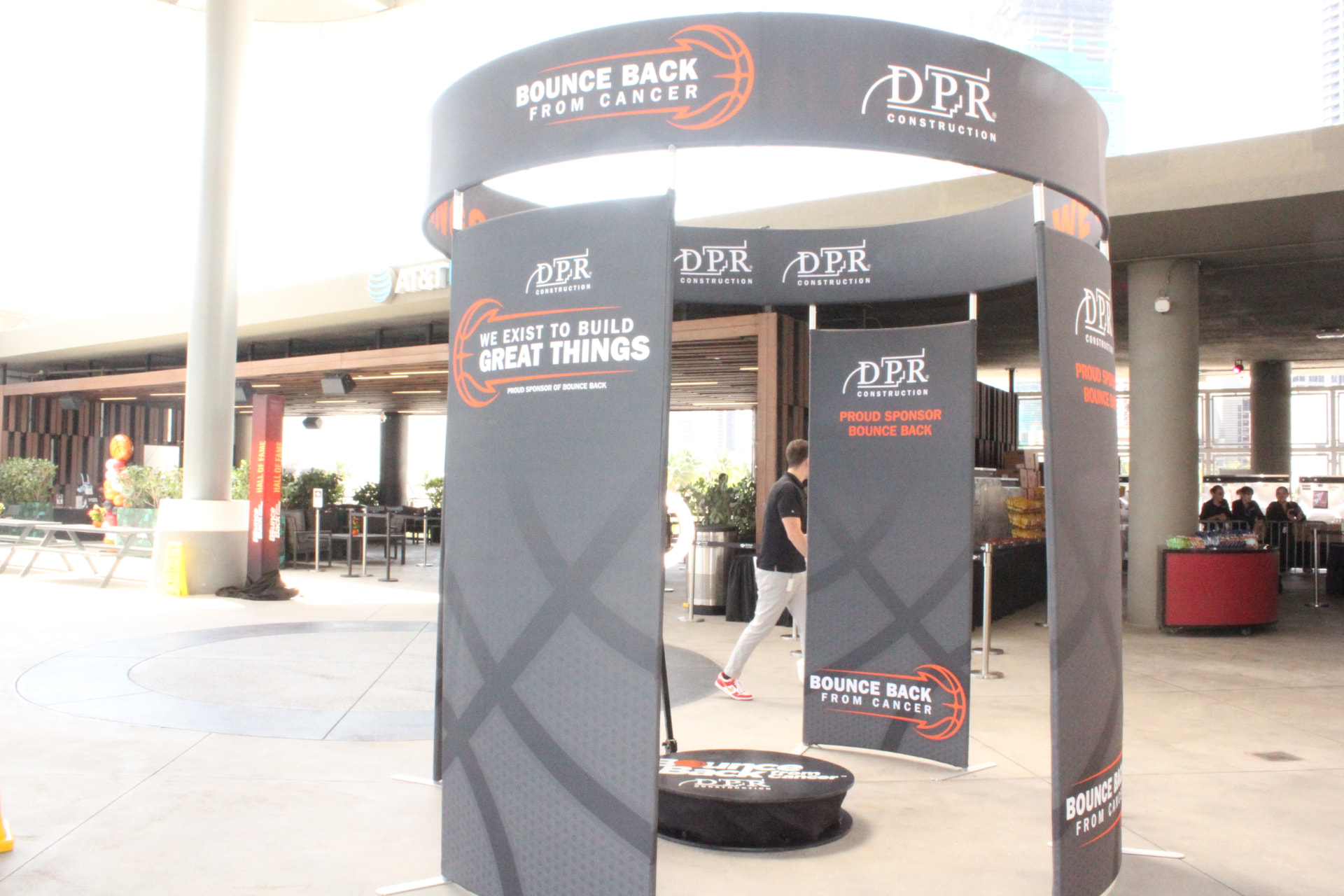 Full view of the enclosed SnapJoy 360 Pavilion with Bounce Back From Cancer and DPR Construction branding at the Kaseya Center