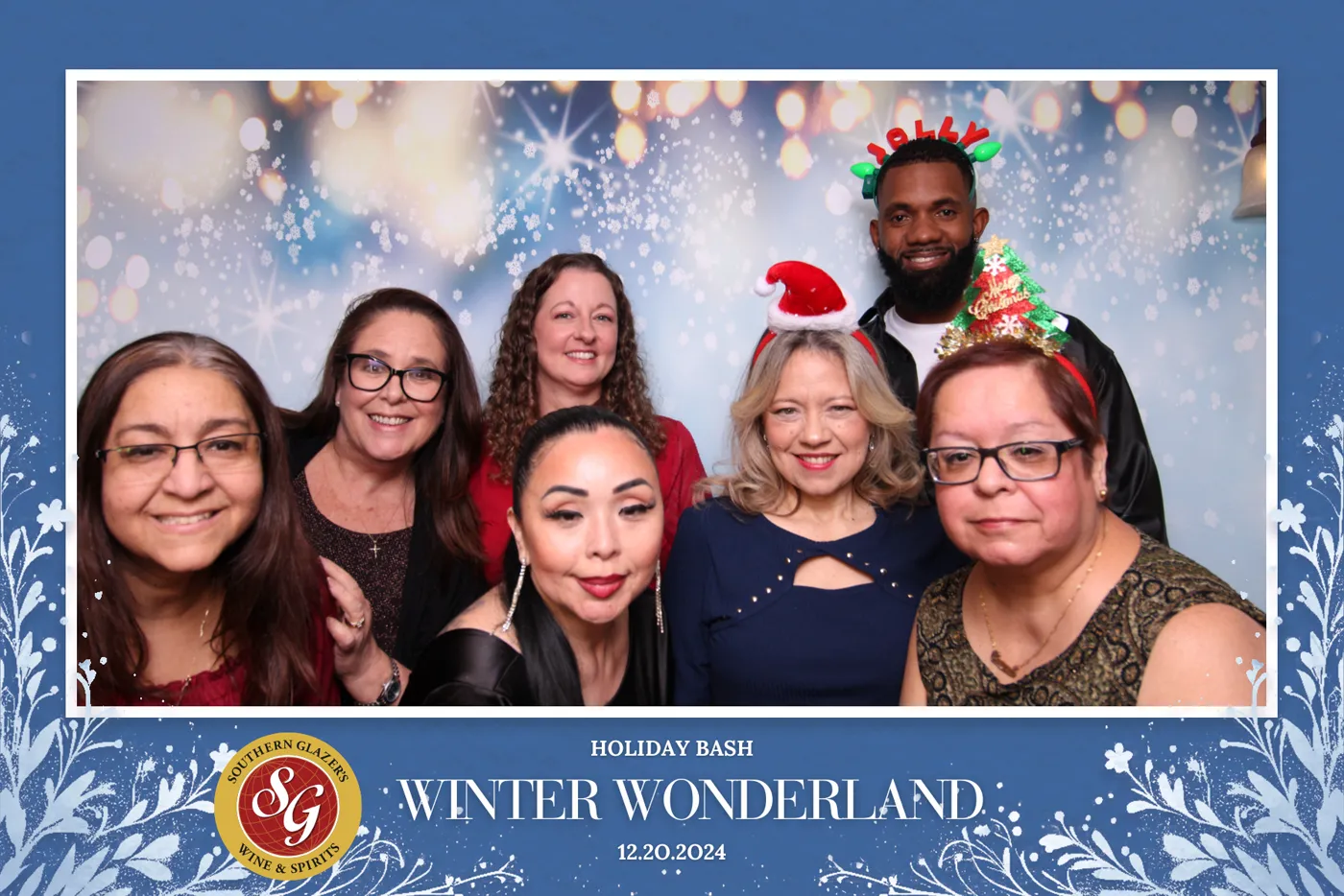 Team portrait in a custom-branded Winter Wonderland corporate holiday photo booth