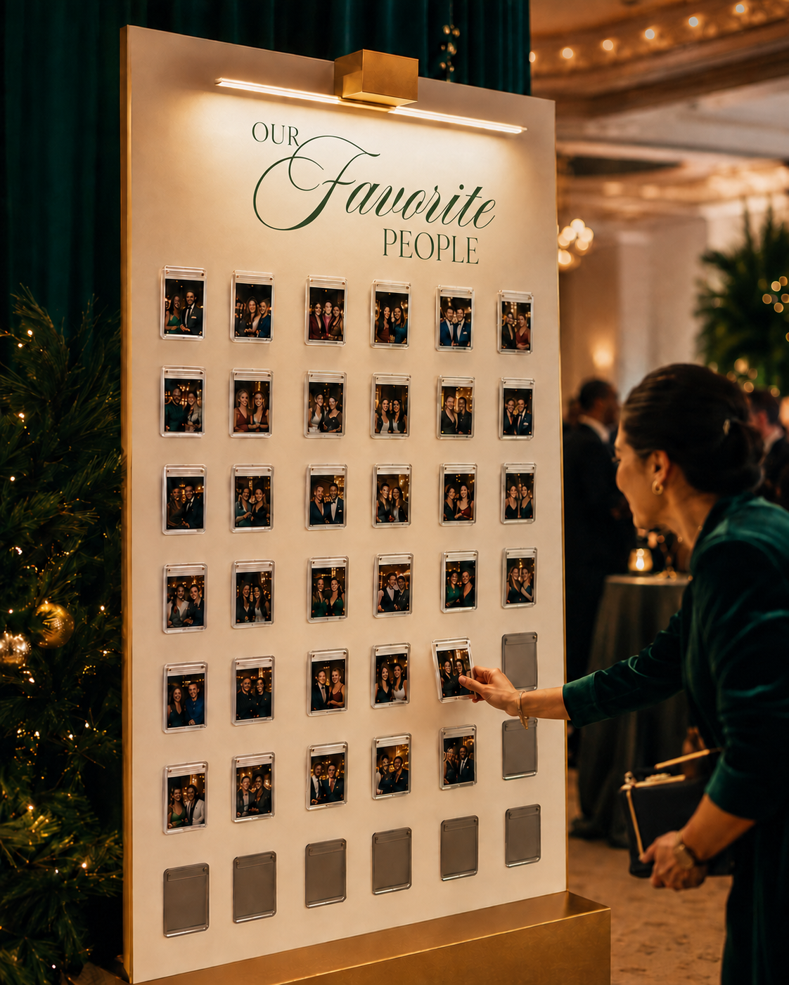 Magnetic gallery wall with guest portraits labeled Our Favorite People at a corporate holiday event