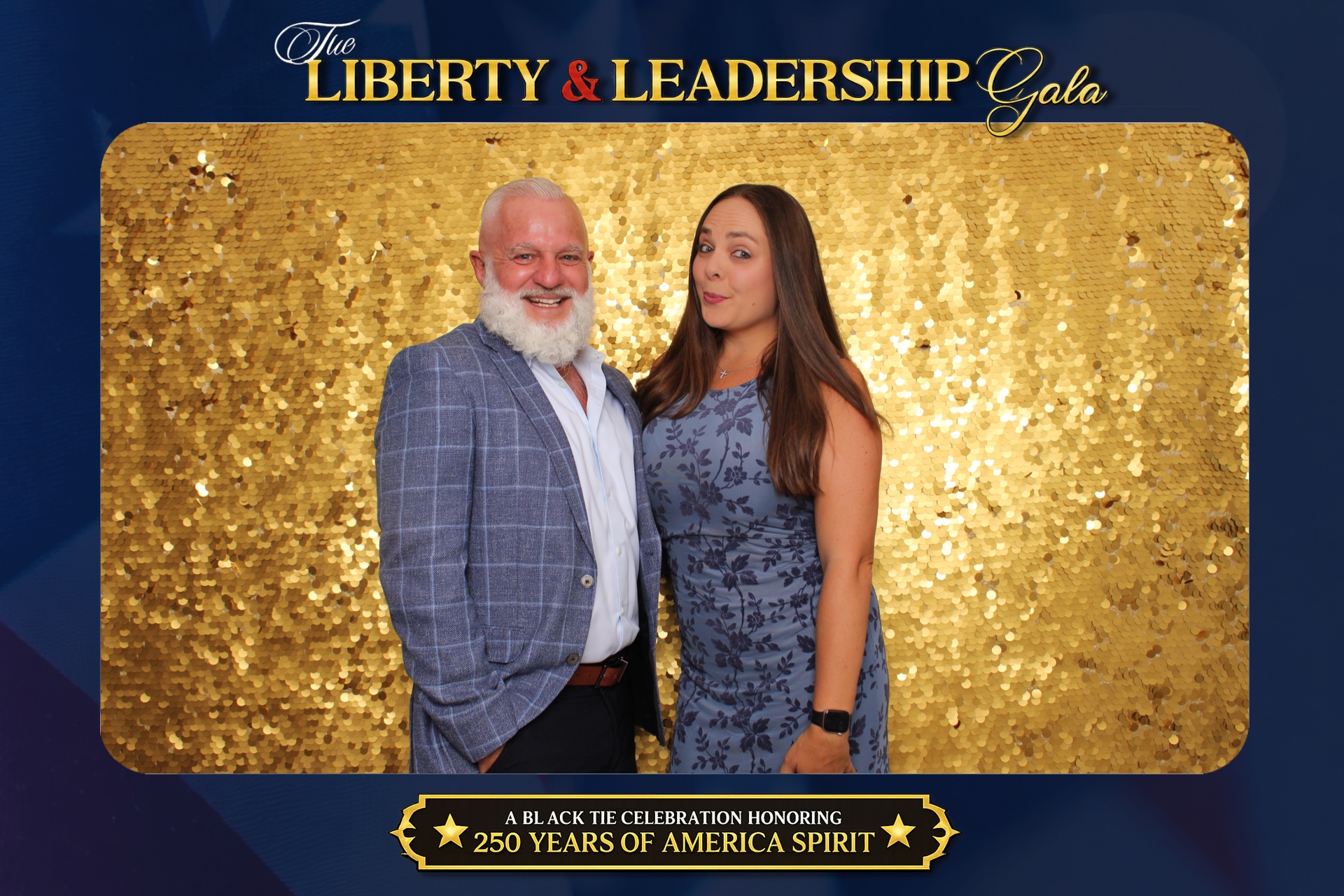 Two guests laughing during their gala photo experience portrait on a gold sequin backdrop