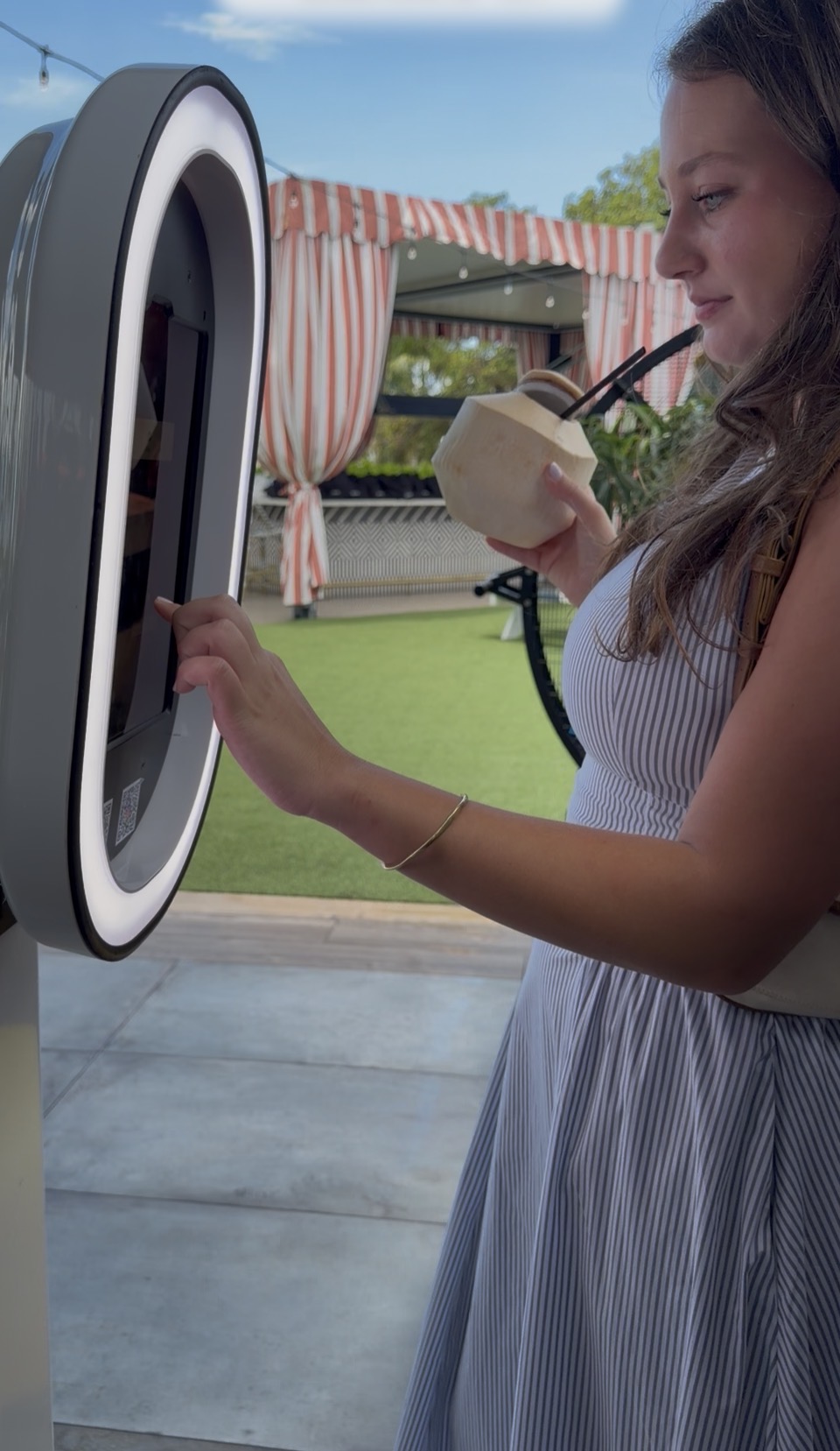 A guest starting a session on the open-air SnapBar touchscreen