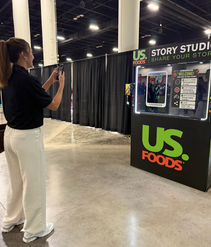 Wide view of the US Foods Story Studio activation on the trade show floor